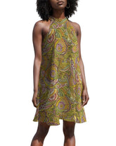 vibrant green and yellow paisley print halter dress with a flowy silhouette. The dress features a halter neckline and a relaxed, comfortable fit.